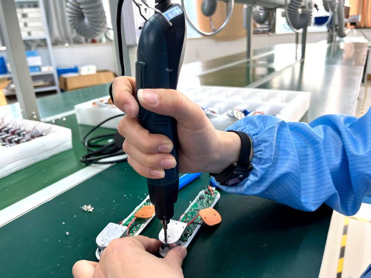YouWeMed production worker assembling a healthcare device