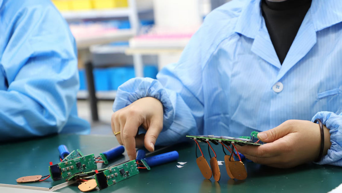YouWeMed engineering team checking electronic assemblies