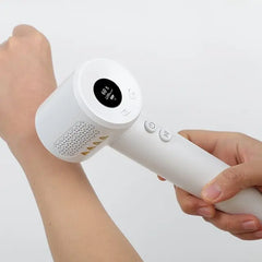 Person using UV308E portable 308nm LED UVB light device at home