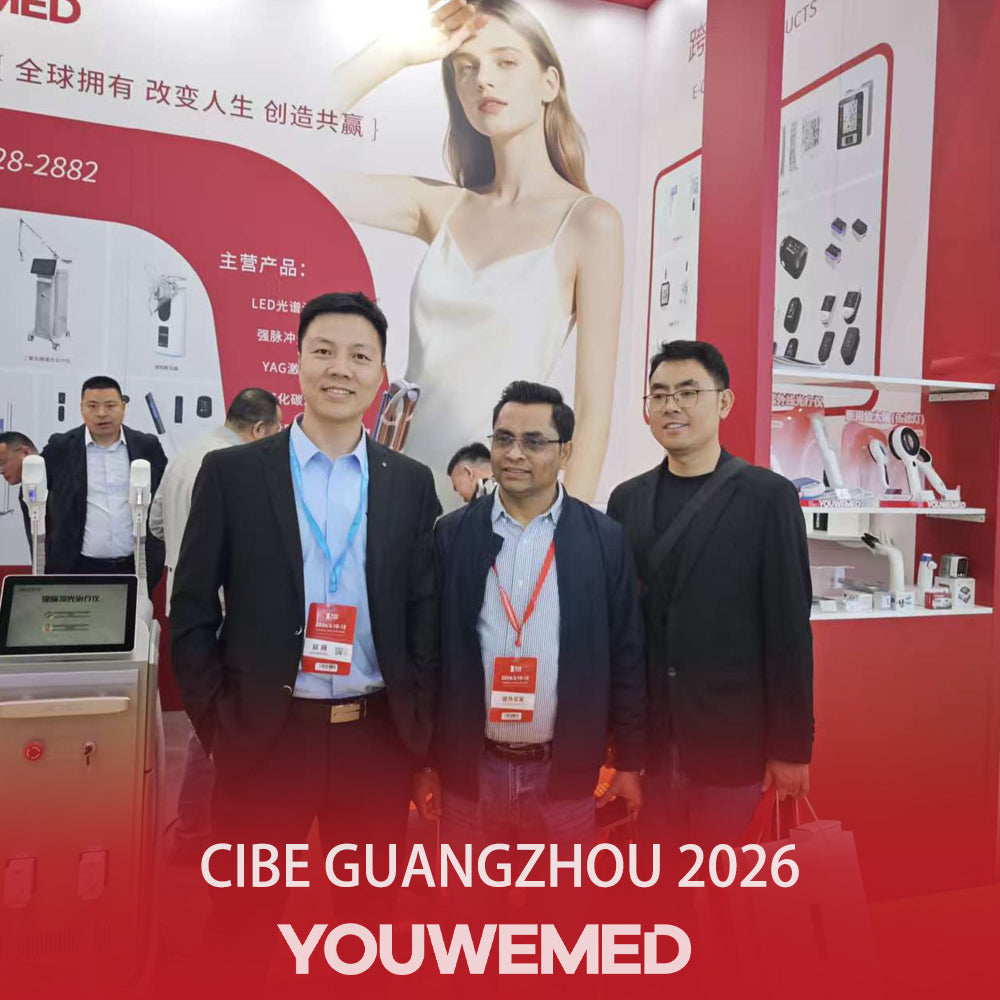 YouWeMed team with an international visitor at an exhibition booth